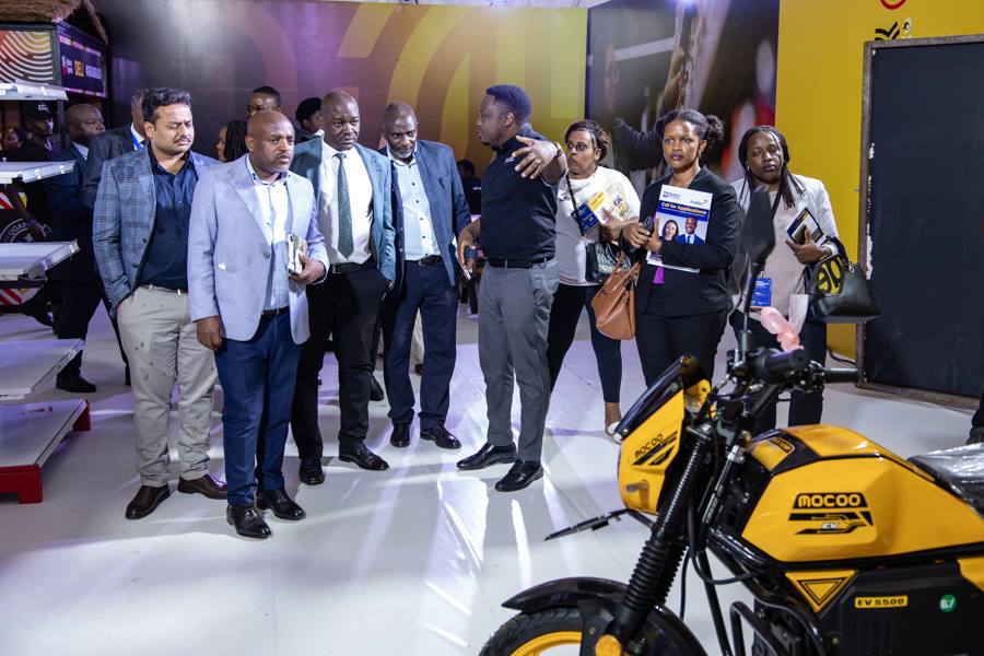 Guests touring the EV motorcycle stand